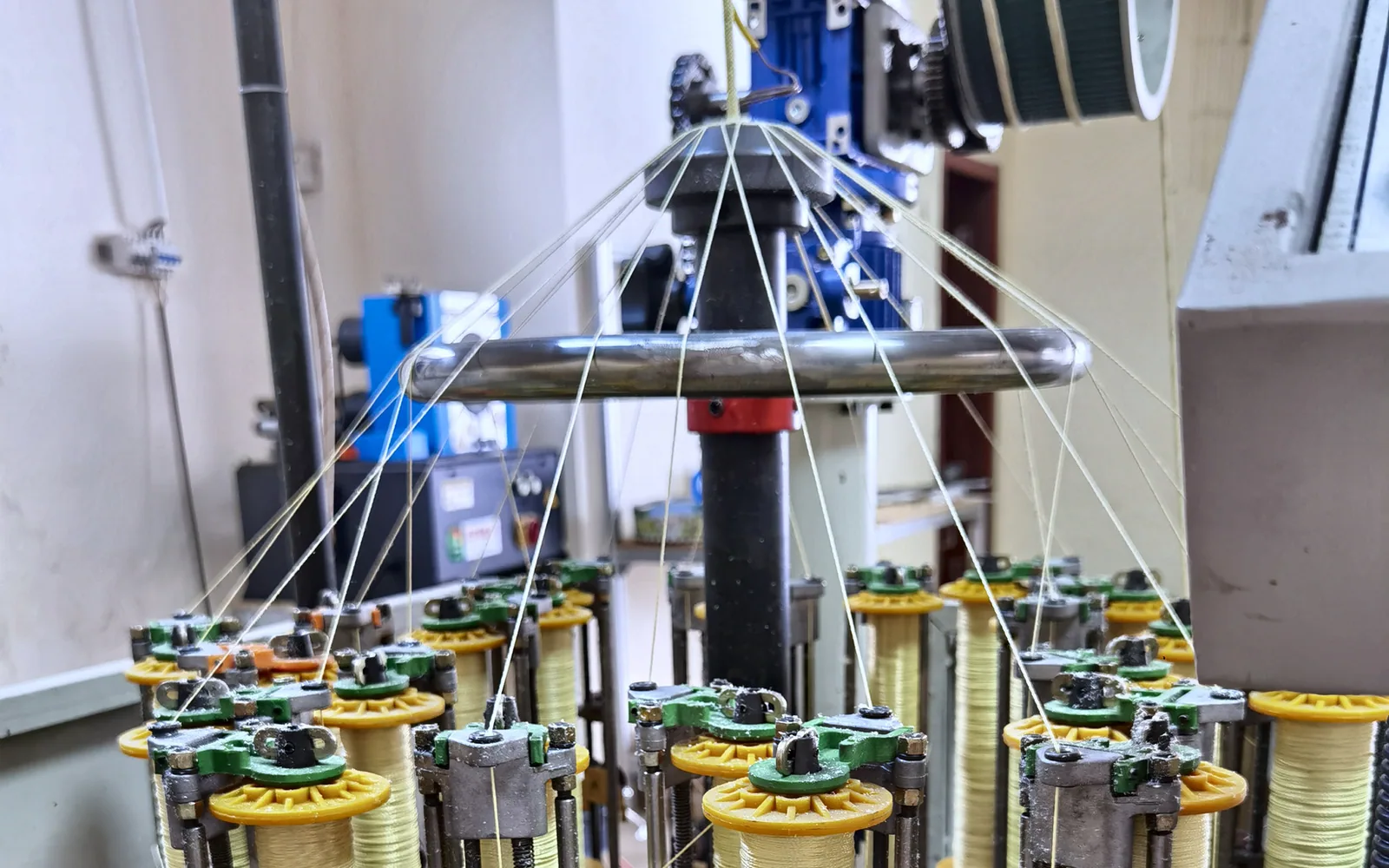 Spools and dedicated line braiding equipment